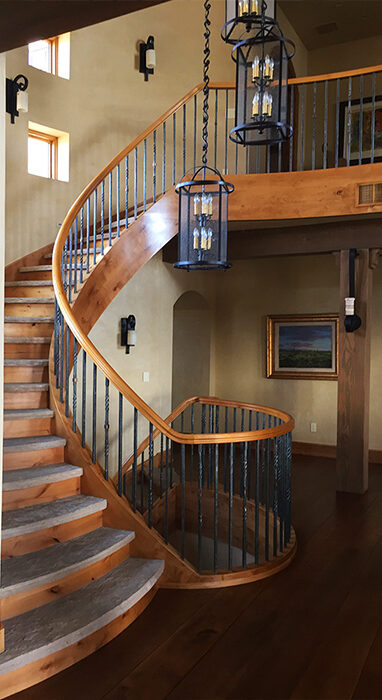 Custom Forged and Finished Interior Rail on Custom Wood Curved Staircase