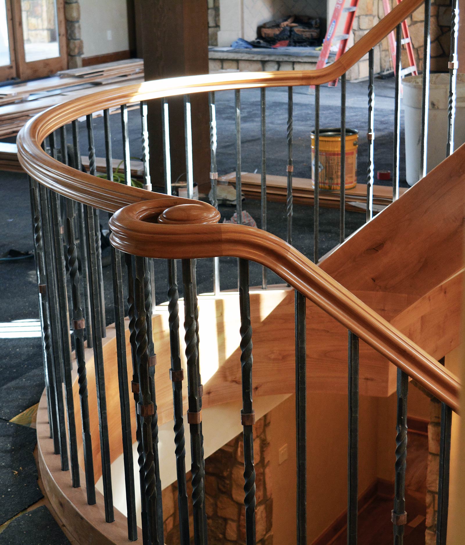 Custom Forged and Finished Interior Rail on Custom Wood Curved Staircase